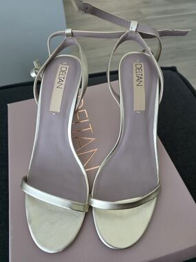 DELTAN Gold Leather Ankle‑Strap Stiletto Sandals